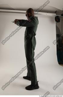 12 2018 01 ERIC STANDING POSE WITH GUNS